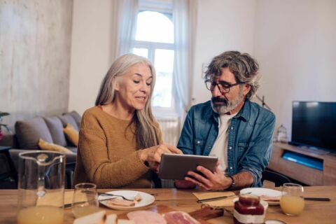Couple with tablet researching options